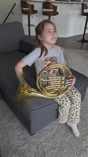First time trying French horn. The French horn is a brass instrument known for its mellow sound and wide range of notes. It's a staple in orchestras, concert bands, and chamber ensembles. #frenchhorn #teachthemyoung #musiclesson #musiclessonsforkids