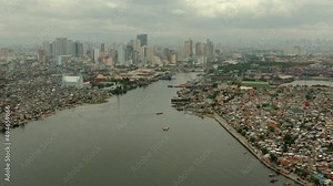 Populous city of Manila, the capital of the Philippines with skyscrapers, streets and buildings. Travel vacation concept.