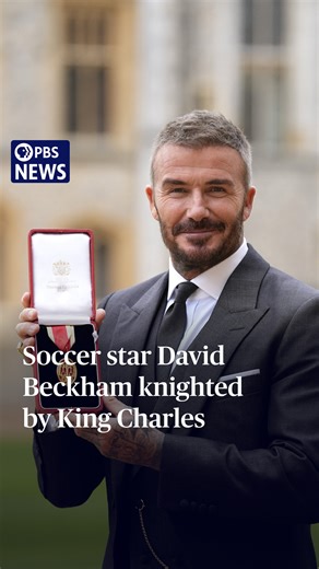 David Beckham is now officially Sir David Beckham. The soccer legend was knighted on Tuesday by King Charles III during an investiture ceremony at Windsor Castle. Beckham, 50, was recognized for services to his sport and for his charity work. The honor also means that his wife, pop star-turned-fashion designer Victoria, is now Lady Beckham. After the ceremony, Sir David said that the honor was, without doubt, his proudest moment. | PBS NewsHour