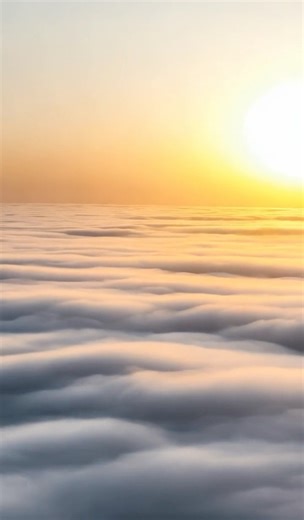 Flying over clouds over the ocean