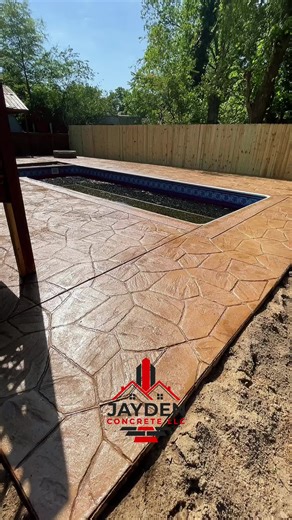 Stamped concrete offers the beauty of pavers with added durability and lower maintenance. It provides stronger protection, is easier to care for, and saves money while adding long-term value to your home. This pool deck and fire pit area was an amazing transformation—designed for beauty, comfort, and lasting performance. #PoolDeck #FirePitArea #OutdoorFirePit #PoolsideLiving #BackyardGoals