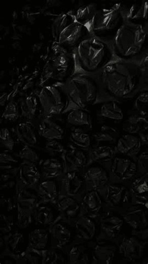 clip-4007254407-black-bubble-wrap-texture-background-dark-plastic