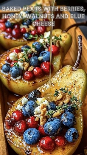 Pears halved cleanly. Sprinkle cinnamon, honey, walnuts. Bake at 375°F for 25–30 minutes until tender, warm, golden, and melty with sweet berries and blue cheese. Ingredients ➤ 3 ripe pears, halved and cored ➤ 2 tbsp melted butter ➤ 2 tbsp honey ➤ 1/2 cup fresh mixed berries ➤ 1/4 cup chopped toasted walnuts ➤ 1/4 cup crumbled blue cheese or gorgonzola ➤ 1/2 tsp cinnamon FULLL Recipe in First Cօʍʍеոτ 👇👇 | Nessy Recipes