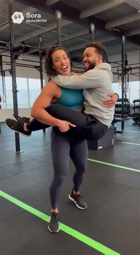 female bodybuilder lift carry small man koala style