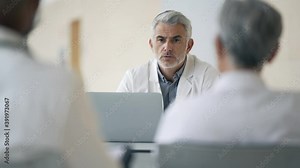 Doctor giving lecture to medical students at the hospital