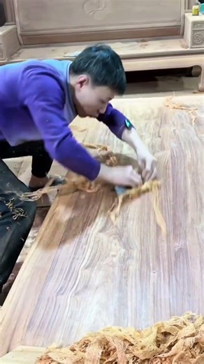 Precise carving of leaf patterns on a wooden surface with a computer numerical control machine now
