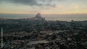 Skyline of the Spanish city Calp in the province of Alicante. Spanish town Calpe and mountain Penyal d'Ifac Natural Park on background.