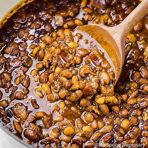 These southern style HOMEMADE BACON, BOURBON & BROWN SUGAR BAKED BEANS are jam packed with bold BBQ flavor and taste a billion times better than the stuff from a can! Smoky, spicy, and sweet, these beans are perfect for your next potluck, barbecue or summer soiree! This recipe includes instructions for canned or dried beans, plus directions for the oven, stove top and slow cooker! Printable Recipe: https://www.nospoonnecessary.com/bacon-bourbon-brown-sugar-baked-beans/ | No Spoon Necessary - Uni