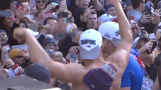 New England Patriots tight end Rob Gronkowski catches beer while shirtless during Super Bowl LIII victory parade