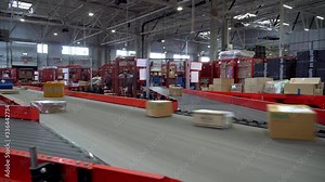 Postal Parcel Sorting Line, Postal Conveyor System, Parcels are Moving on Belt Conveyor at Post Sorting Office Stock Video
