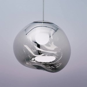 MELT: our organic, imperfect and naturalistic lighting object. ⁠Created through blow moulding and vacuum metallisation, we achieve melted orbs with abundant and unusual luminosity⁠ ⁠ This half-mirrored effect, often seen on a smaller scale in fashion sunglasses, creates a hyperreflective, mirror finish when turned off. When switched on, it transforms into a translucent colour with a mesmerizing hot blown glass effect. https://bit.ly/3qWTFrn | Tom Dixon