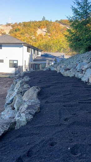 Rock wall with 7 foot flower bed in the middle for trees and shrubs. Love helping customers bring their visions to life. | Jordan Rock LLC