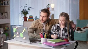 father helping daughter with homework during online lessons, man and girl having fun and giving each other five happy school tests