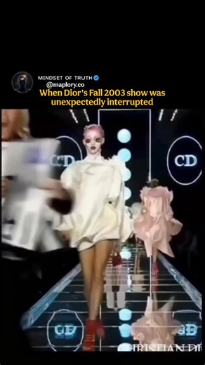 ᴍɪɴᴅꜱᴇᴛ ᴏꜰ ᴛʀᴜᴛʜ on Instagram: "The Dior Fall/Winter 2003 ready-to-wear show in Paris, led by creative director John Galliano, took an unexpected turn when an animal rights protester stormed the runway. A woman affiliated with PETA suddenly stepped onto the catwalk holding a sign reading “FUR SHAME,” loudly protesting the use of animal fur in fashion. The interruption briefly halted the show before security quickly escorted her away. What made the moment especially striking was what followed: th