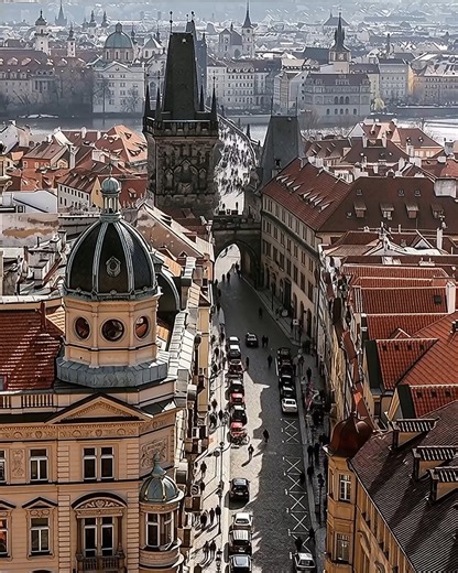 Watching the river of life flow through Prague. 🌇✨ From this high vantage point, see the day's golden light fade into a cascade of city lights, with cars and people bustling towards the iconic Charles Bridge. This is the heartbeat of the city! ❤️🚗🏰 "Cities have a rhythm, a pulse. You just have to be still enough to feel it." Hashtags: #Prague #PragueTimeLapse #CharlesBridge #CityPulse #CityLife #TravelReel #DayToNight #ViewFromAbove #CzechRepublic #VisitPrague #czechrepublic #czech #praga #pr