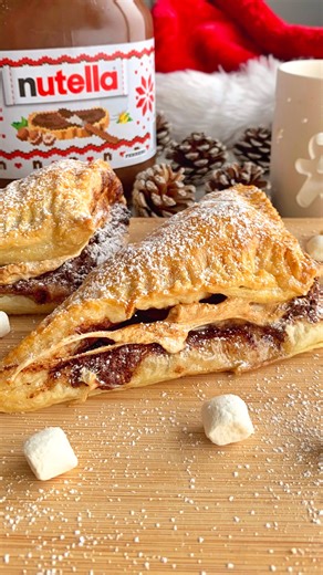 Fitwaffle Kitchen | Eloise on Instagram: "Nutella marshmallow turnovers 😍 Light & crisp puffy pastry, stuffed with Nutella and gooey marshmallow 🤌 They’re quick and easy to make and absolutely delicious! Sound on for full instructions 🔉 All you need is: 1 sheet of ready-roll puff pastry Nutella or any chocolate spread Mini marshmallows or marshmallow fluff Egg wash (1 small egg + 1 tsp water) Icing sugar to dust Enjoy! #fitwaffle #fitwafflekitchen #easyrecipes #christmas #puffpastry"