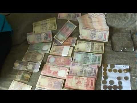 One Lakh (100,000) Indian Rupees; all denomination notes & coins, India: 1st May 2012
