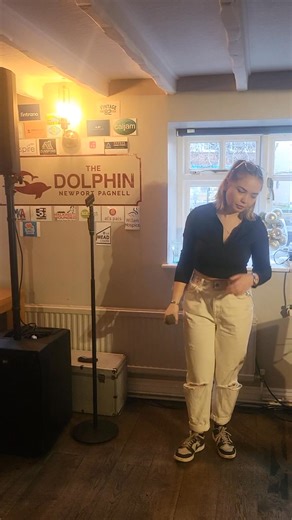 Keely-Beth James is LIVE 🎤 Our 2nd act of the day, proudly sponsored by Caljam 🙌 The roasts are coming out hot and fast, the festive vibes are flowing, and the atmosphere is spot on. Still here. Still raising money. Still having fun. If you’re nearby… you know where to be 👀🍽️🎶 | The Dolphin Newport Pagnell