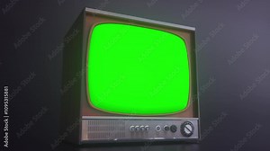 Retro TV Set with Green Screen. Old television with noise and green screen in empty dark studio