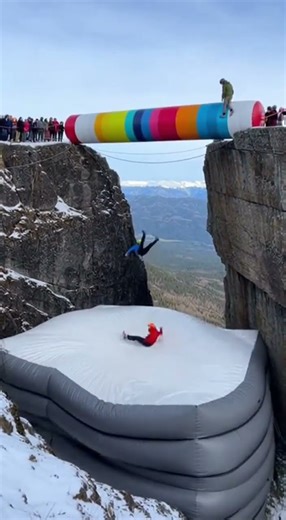 Colorful Inflatable Drop Between Cliffs - Massive Airbag Rebound Stunt