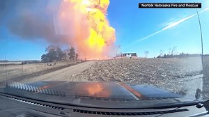Dash-cam captures explosive moment as propane tank erupts during fire