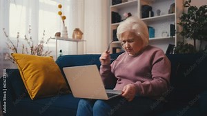 Senior woman having problems with her computer, scammed, phishing victim Stock Video