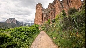 Camino Natural de la Hoya de Huesca - a path entering Las Penas de Riglos village, comarca of Hoya de Huesca, province of Huesca, Aragon, Spain