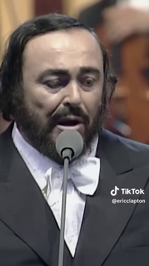 Eric Clapton and Luciano Pavarotti perform