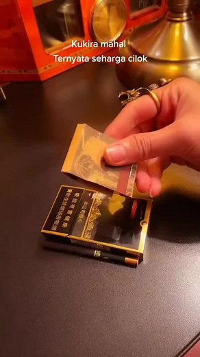 Intricate Golden Lighter Unveiled: Hidden Compartment Surprise