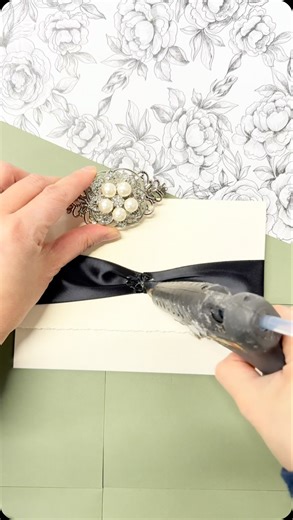 Stephita Wedding Invitations on Instagram: "Slow, intentional details ✨ Hand-torn deckle edges, carefully glued ribbon, and the finishing touch of a brooch—each invite made with love. #weddinginvitations #weddinginvites #deckle_edge #decklededgepaper"