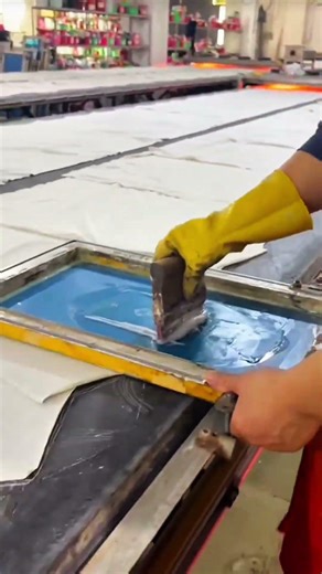 Squeegee drags ink mesh spreads white floods design presses fabric receives print