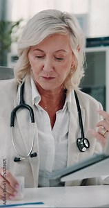 Laptop, doctor and woman with medicine in office, reading side effect list and dosage for prescription. Healthcare, medical info and mature person explaining with pc, instructions and pill benefits.