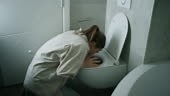 Woman Vomiting In Bathroom