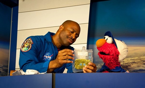 Elmo Visits NASA: Don’t Eat the Pumpkin Suits!