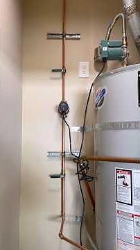installing a recirculation pump and new drain valve on a water heater