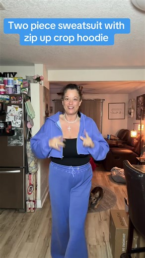 2 piece sweatsuit by fashion nova, color blue. It features a cropped zip up hoodie. The pants are wide leg with an elastic waist band and functional drawstring. They are tall girl friendly as they are 31 inch inseam. #sweatsuit #wideleg #crop #zipup #hoodie