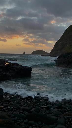 Ocean Sunset: Dynamic Coastal Waves and Cliffs