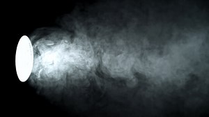 Super slow motion smoke in studio with lighting projector. High quality FullHD footage