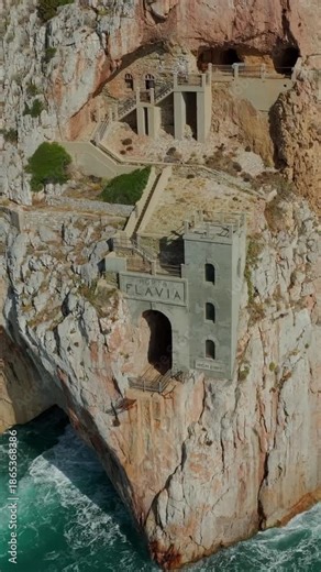 Aerial view of the historic Porto Flavia sea harbor, an old mine on the Sardinian coast