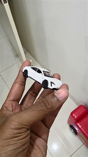 Changed bburago porche taycan rim to black , using acrylic paint. How does this look now?