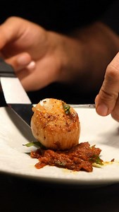 Loch Fyne scallops, perfectly seared, meet the depth of slow-cooked tomato thokku and a gentle hum of gunpowder spice. Crisp kohlrabi pickle brings clarity and contrast. | Swadish