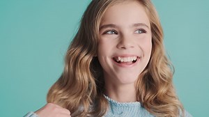 Free stock video - Teenage caucasian girl laughing at the camera.