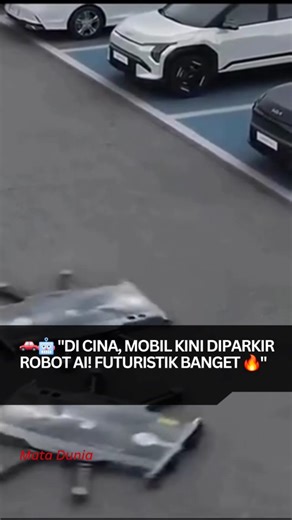 Mata Dunia on Instagram: "Di Cina, robot parkir bertenaga AI diam-diam mengubah lahan parkir biasa jadi garasi pintar masa depan. ➡️ Bisa berputar 360°, meluncur ke samping, dan parkir presisi milimeter tanpa cermin, tanpa stres. Hasilnya? Satu area bisa menampung 2x bahkan 3x lebih banyak mobil. Bayangin kalau teknologi ini hadir di kota kita, parkir bukan lagi masalah besar. 👉 Pertanyaannya, berani nggak kamu percayakan mobilmu ke robot? CTO Robotics"