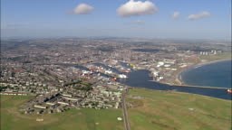 Aerial view approaching the city of Aberdeen and the harbor /...