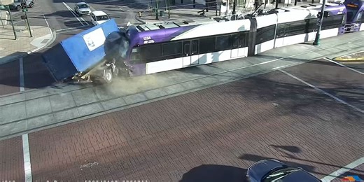 Video shows light rail train fail to stop at intersection, crash into garbage truck