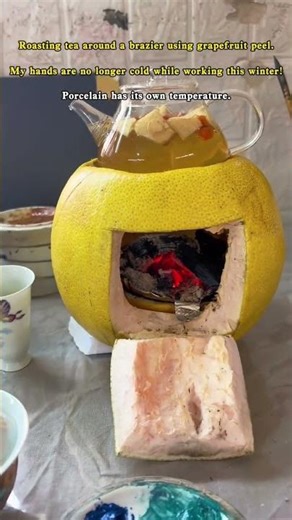 Roasting tea around a brazier using grapefruit peel.