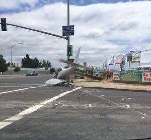 Plane Crash Lands In Intersection; Wing Sheared Off During Emergency Landing