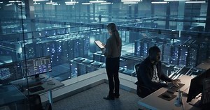 clip-3637485909-female-cybersecurity-expert-standing-her-back-camera