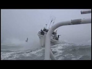 A big wave hits this ship and a man gets ejected to the ocean!