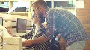 Young Casual business people using computer in the office. Three colleagues working together in creative studio. Brainstorm, Coworking, manager showing new startup idea. Slow motion Stock Video